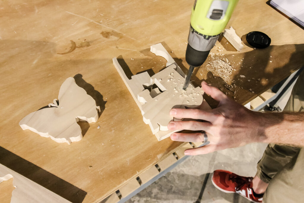 Drilling holes in wooden lacing toy