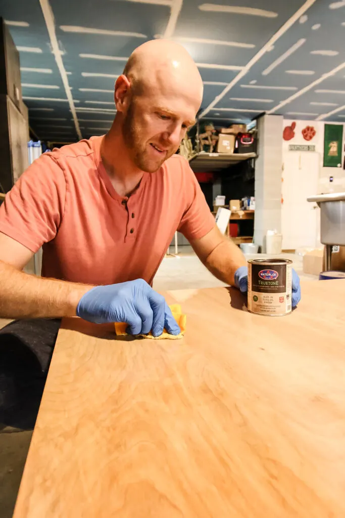 Applying Waterlox Tung Oil Finish to DIY kids art table