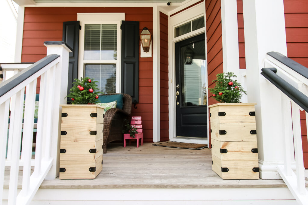 Two tree planters on front porch