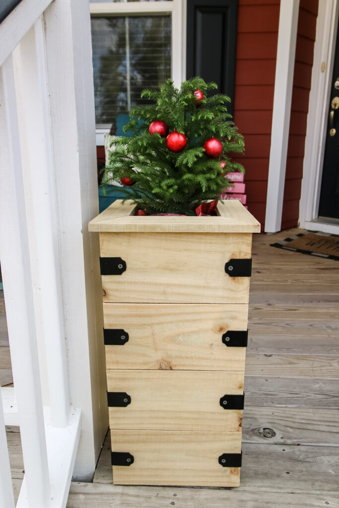 Mini Christmas tree planter on porch