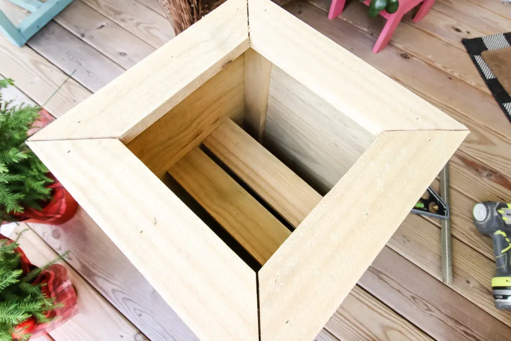 Plant pot bases in planter box