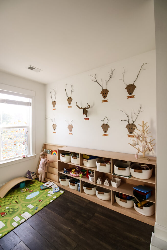 reindeer wall of cardboard and stick reindeers