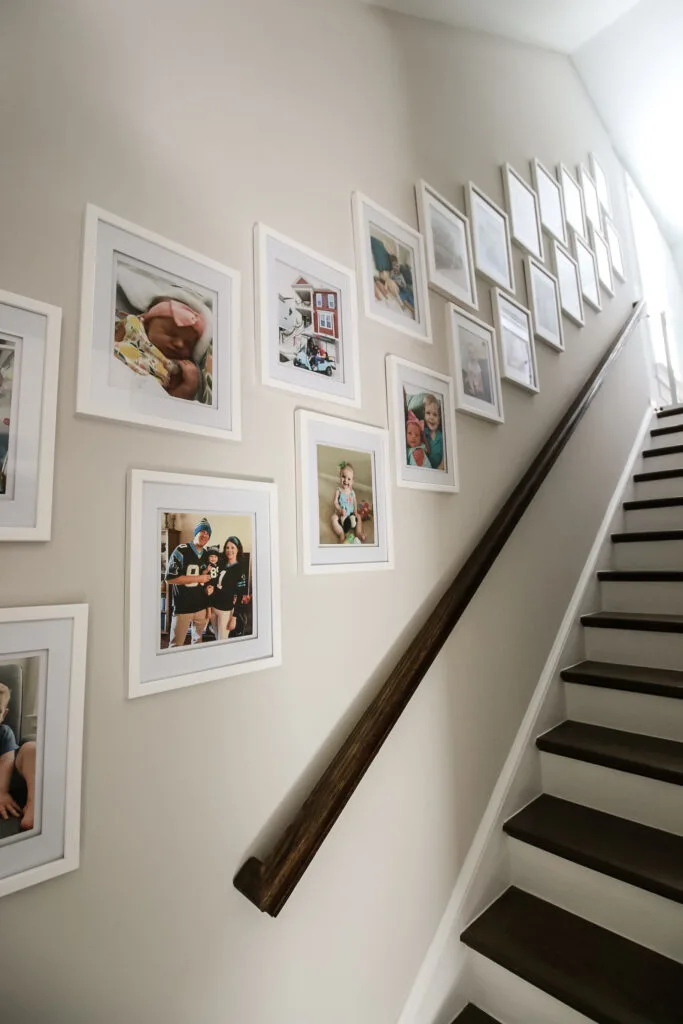 Symmetrical gallery wall on staircase