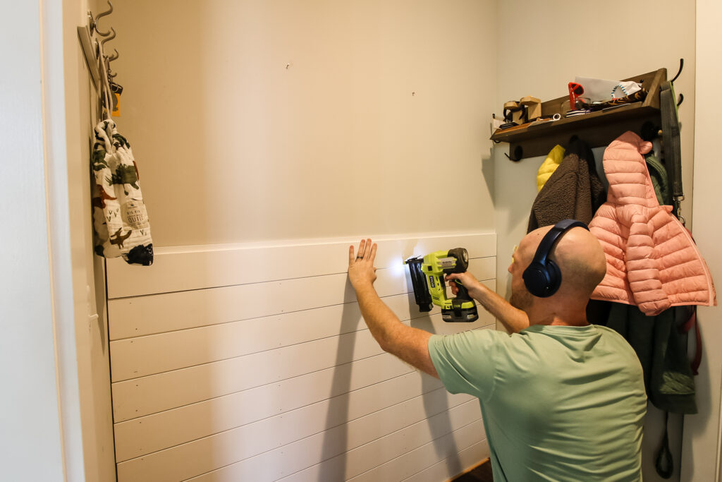 Nailing shiplap boards to wall