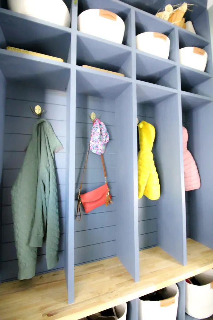 Jackets hanging on modern double robe hooks