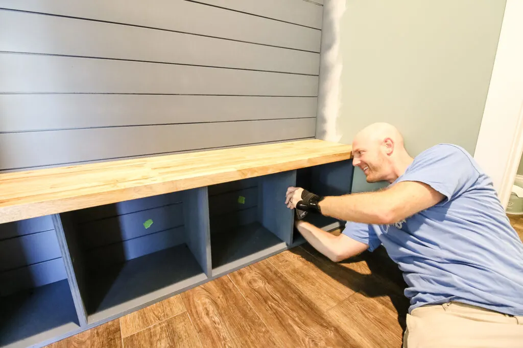 Installing butcherblock bench to mudroom lockers