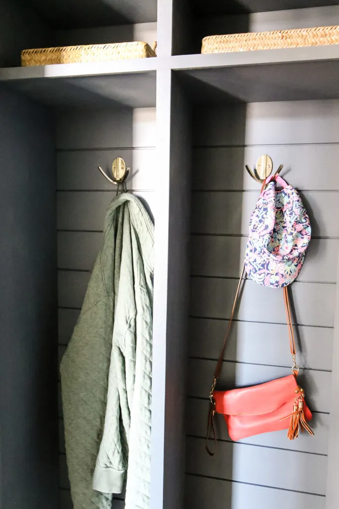 Jackets hanging on modern double robe hooks