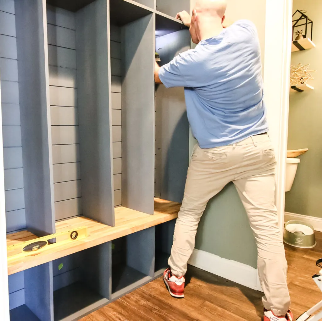 Installing locker dividers into mudroom