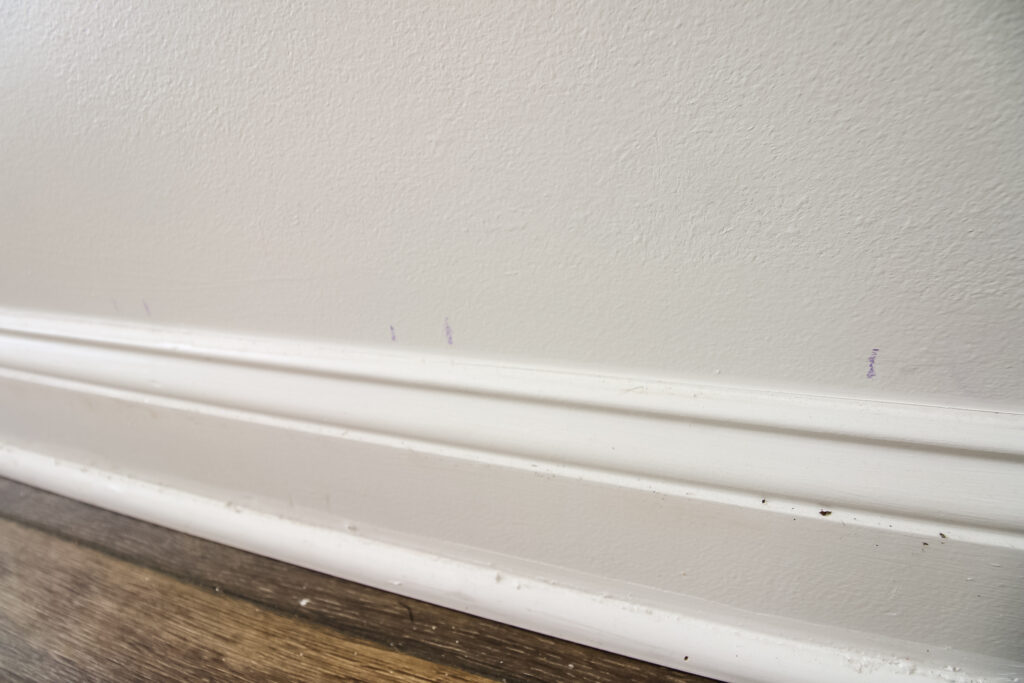 chalk tick marks on the wall for drawing a rainbow mural