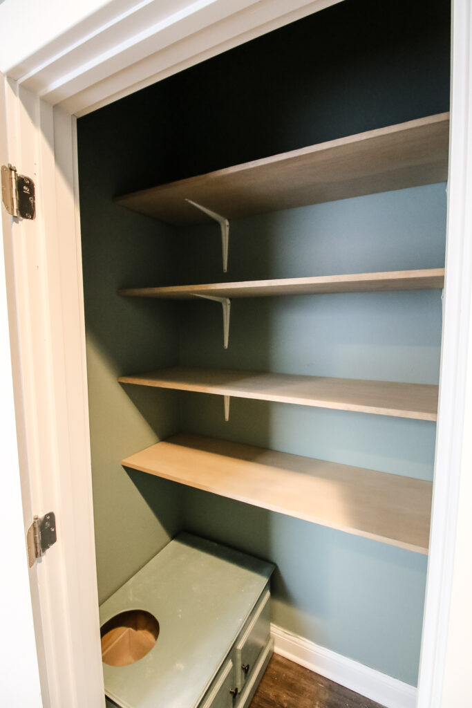 Empty shelves in DIY linen closet