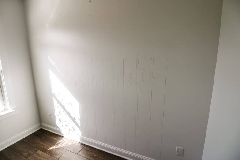 vertical chalk lines to draw a boho rainbow wall mural