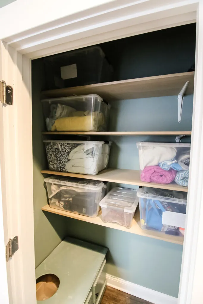 Organized linen closet shelves