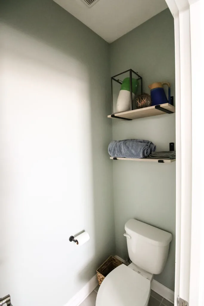 National Hardware floating shelf kit hung in bathroom