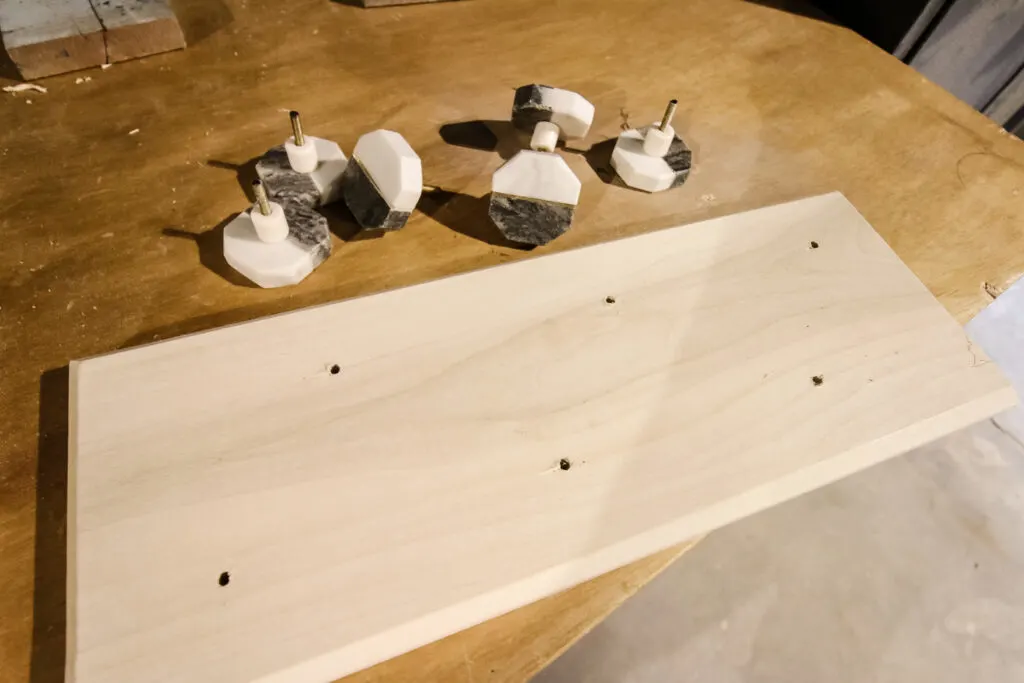 Hook rail board with loose knobs