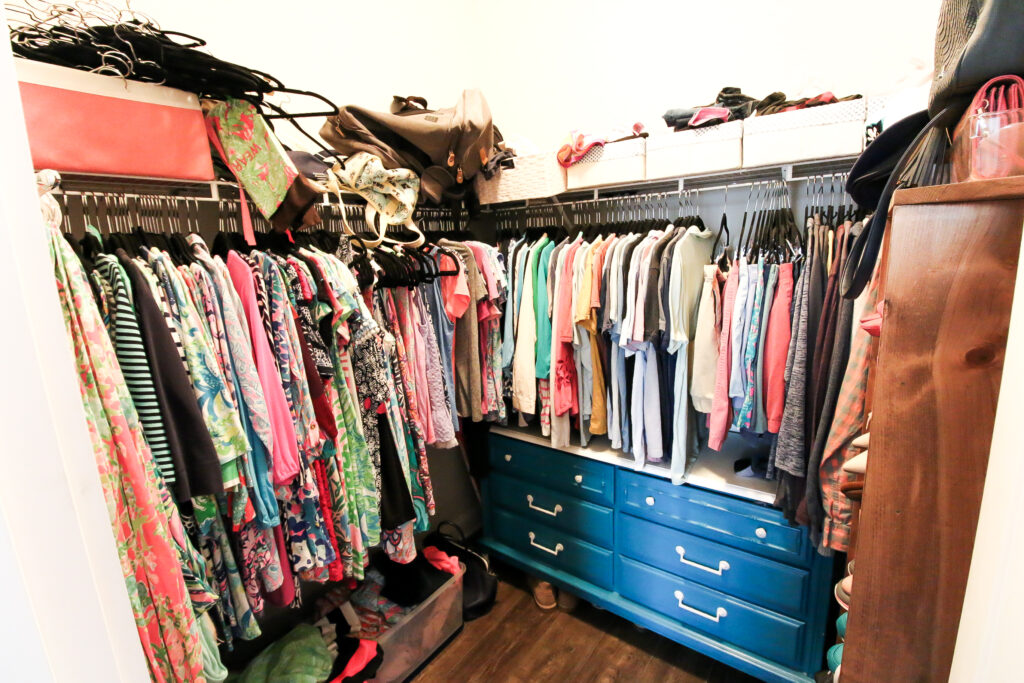 Clothes stuffed into closet before makeover