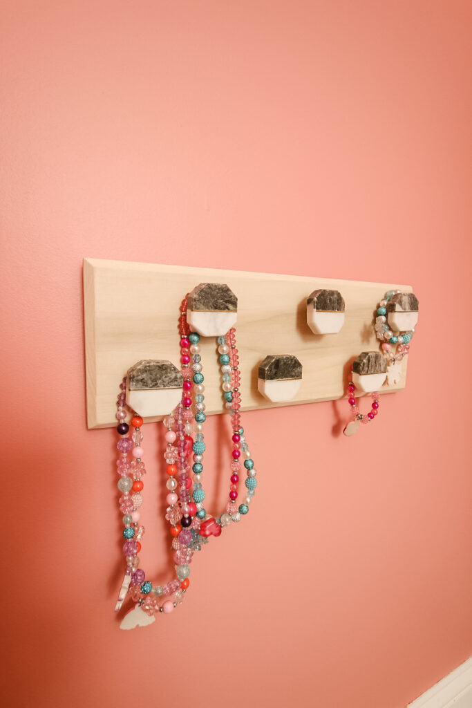 Hook rail with necklaces hung