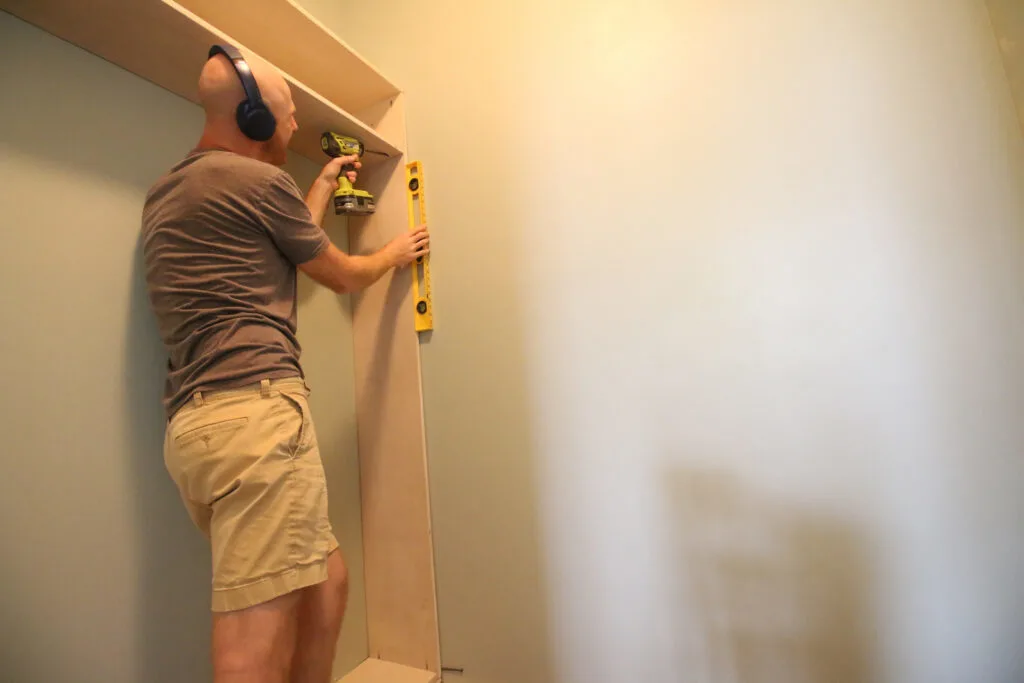 Building custom hanging rods and storage for closet