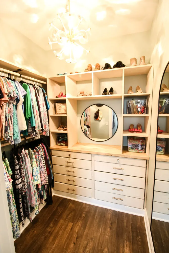 Built in dresser and cubby storage in walk in closet