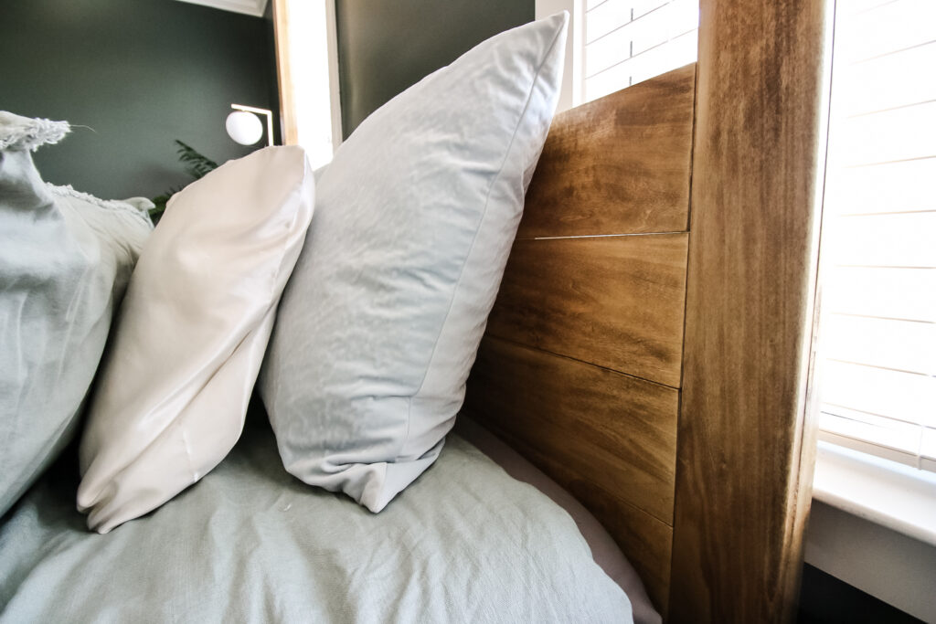 Closet up of headboard on completed DIY four poster canopy bed