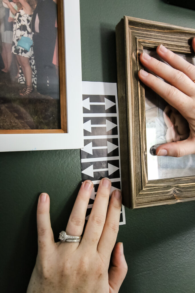 using a paper spacer for evenly spaced gallery wall