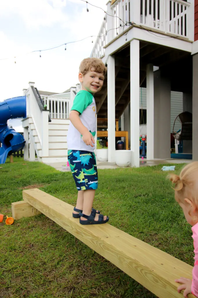 Toddler walking on DIY balance beam