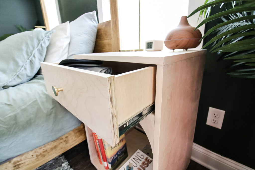 Drawer open with drawer slides on bedside table