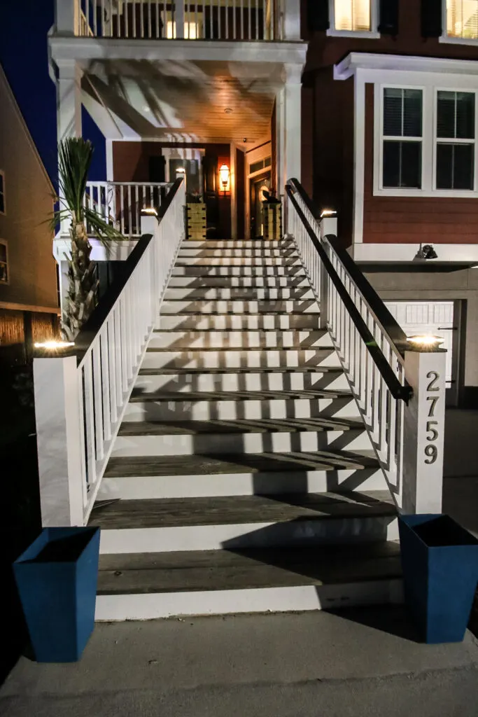 Front entry stairs with solar post cap lights
