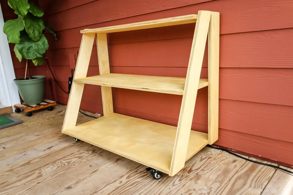 Wide view of empty three tiered rolling plant stand