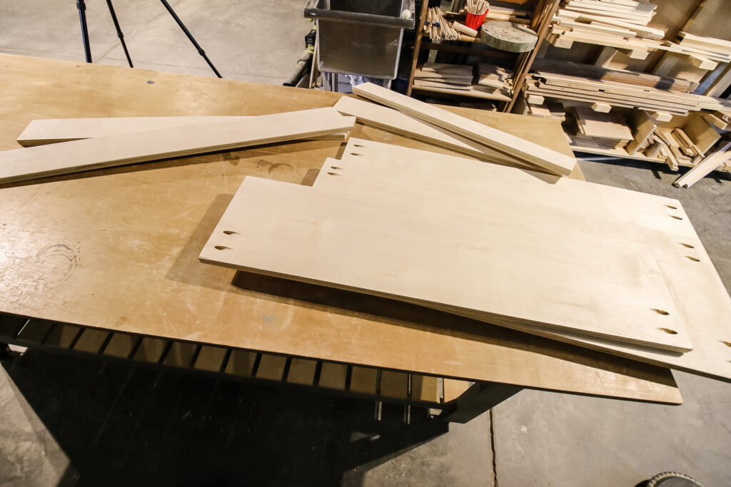 Cut pieces for DIY three tiered rolling plant stand