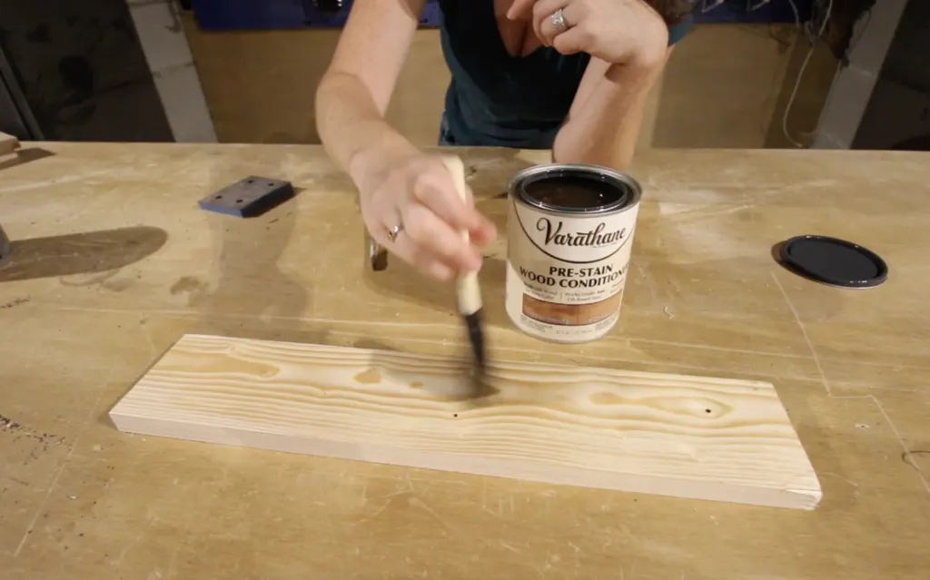 applying pre stain wood conditioner to pine board