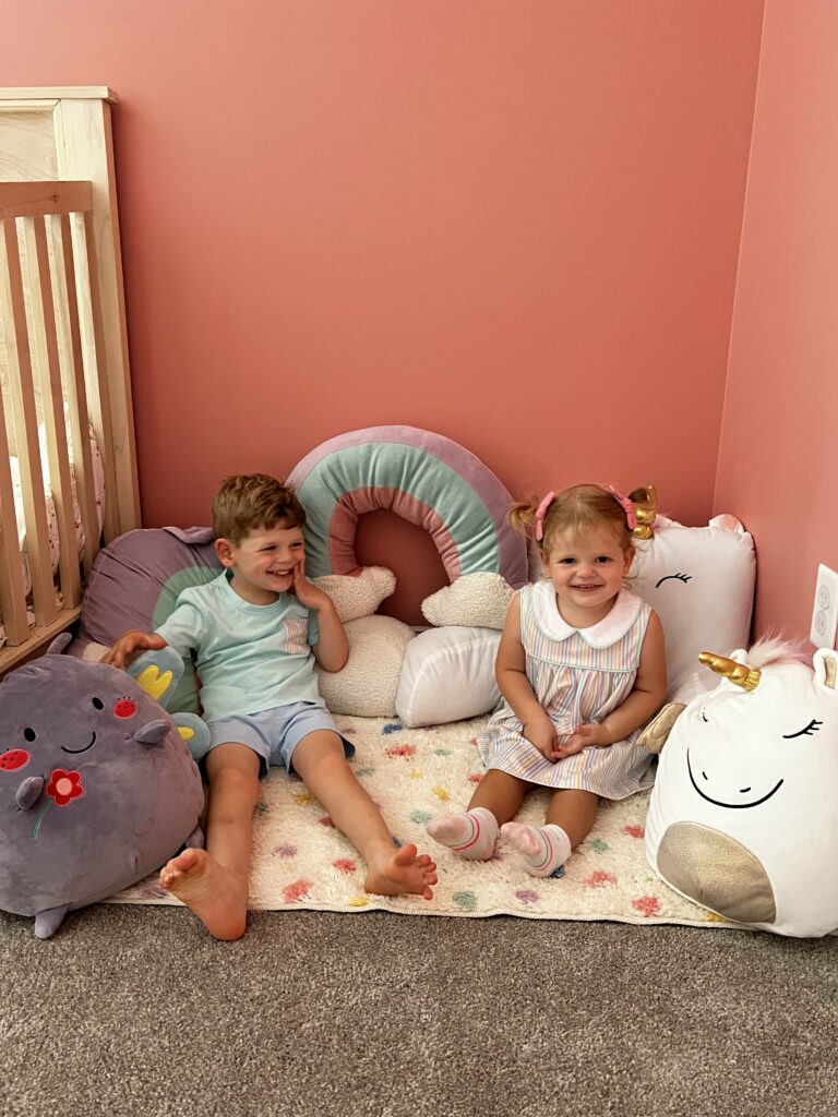 kids snuggling in a corner