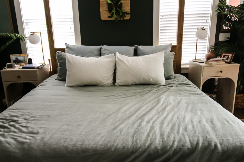 layered pillows on a king bed