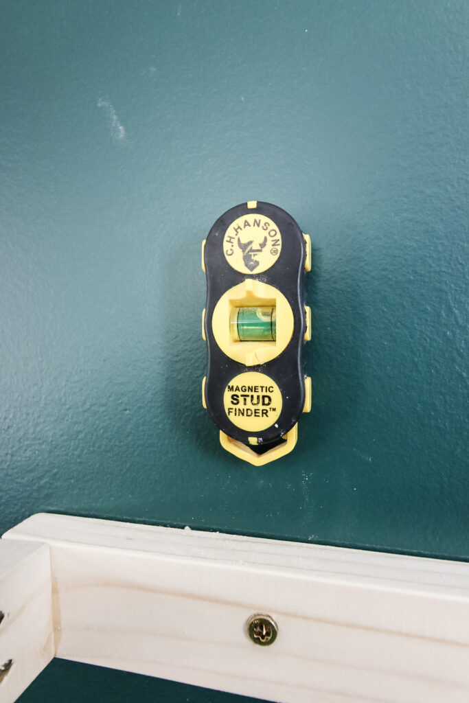 Magnetic stud finder on wall