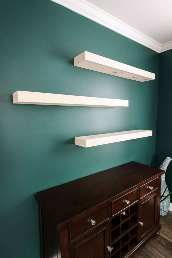 Empty floating shelves in place on wall