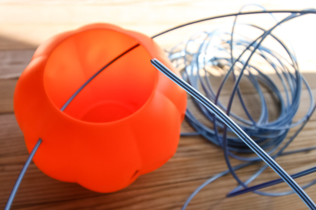 stringing wire on plastic pumpkin