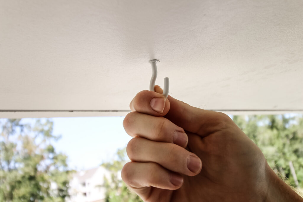 screwing hook into ceiling