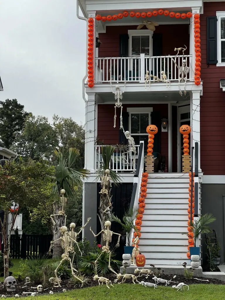 front porch with pumpkin arch and pumpkin steps