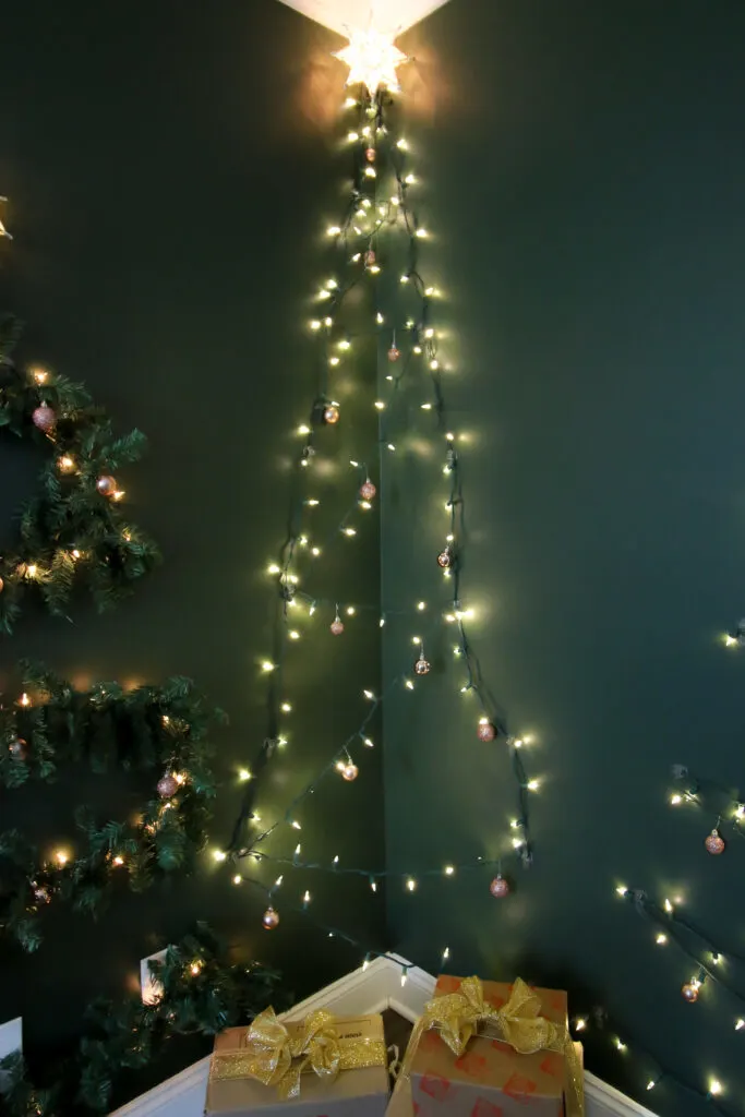 Christmas tree made from lights in the corner of a room