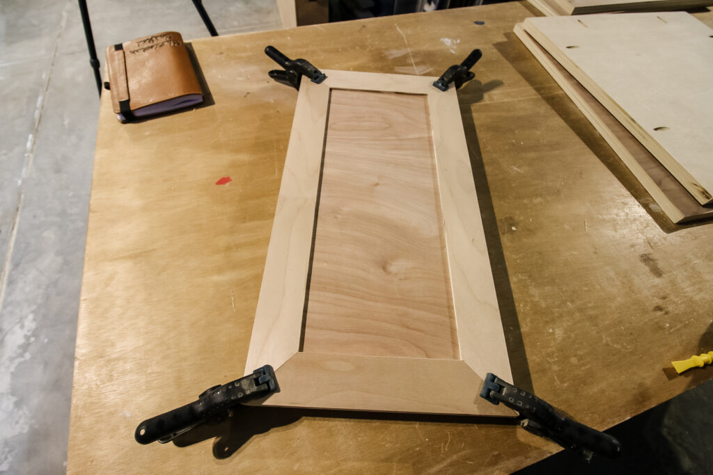 Gluing trim boards to dartboard doors