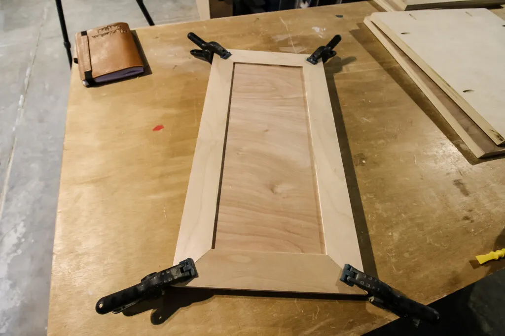 Gluing trim boards to dartboard doors