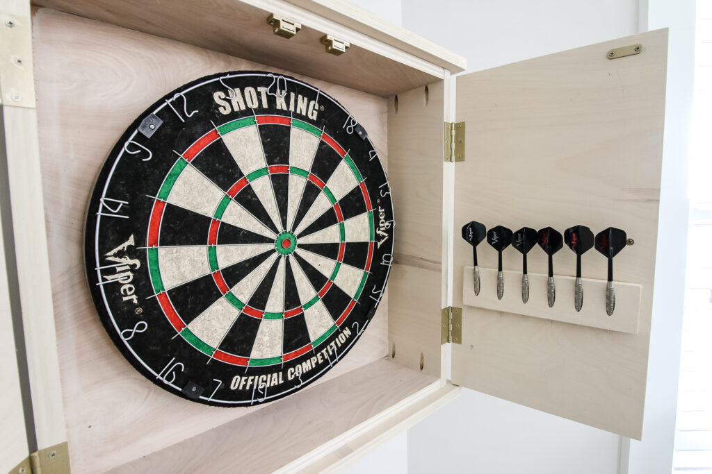 DIY dartboard cabinet with dartboard and darts
