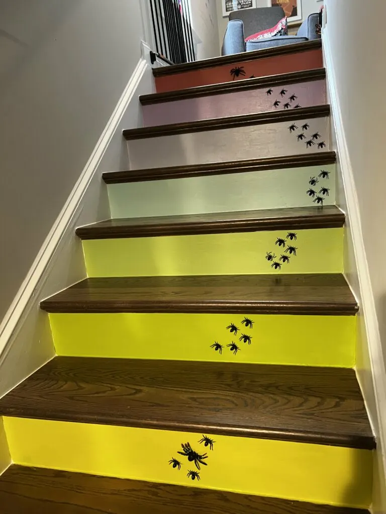 spooky halloween stairs with plastic spiders