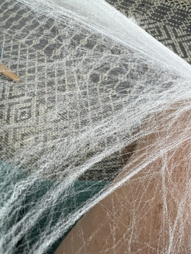 stretching faux spiderweb