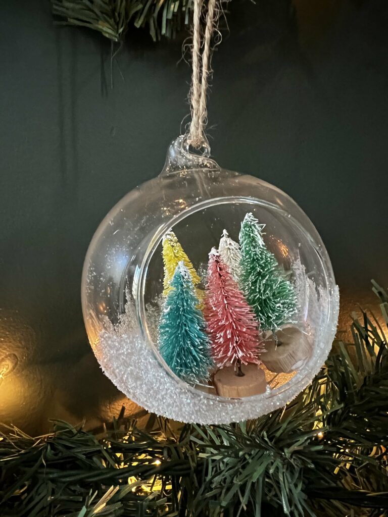 bottle brush christmas tree ornament in a clear terrarium ornament ball