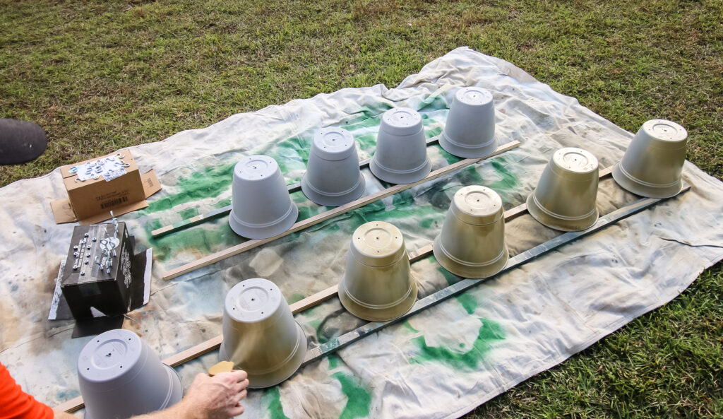 Spray painting pots for jingle bells