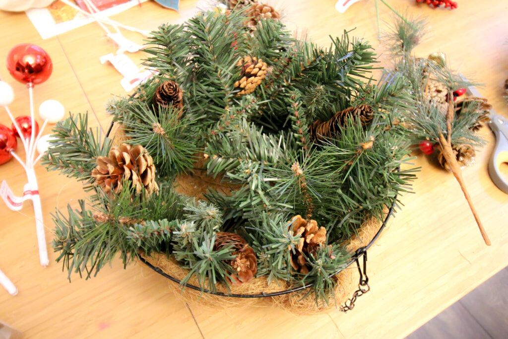 12" faux wreath inside a hanging planter