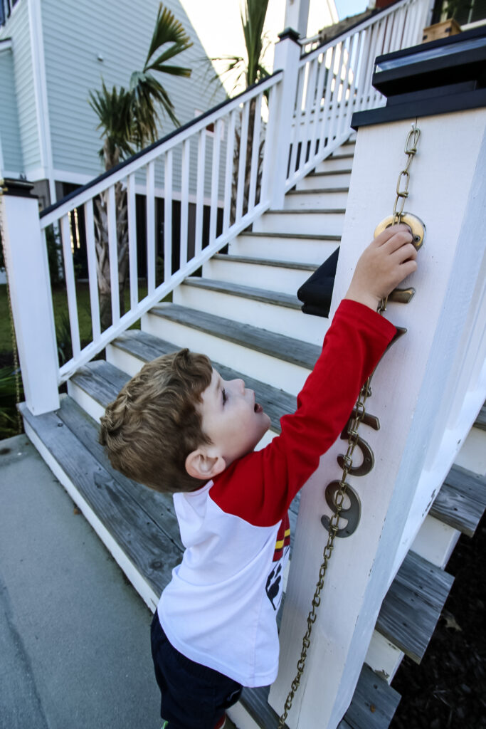 Hanging gold chain onto stair posts