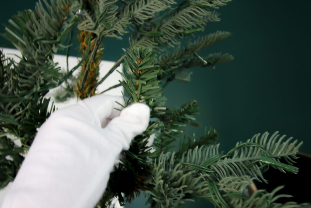 straightening artificial christmas tree branches