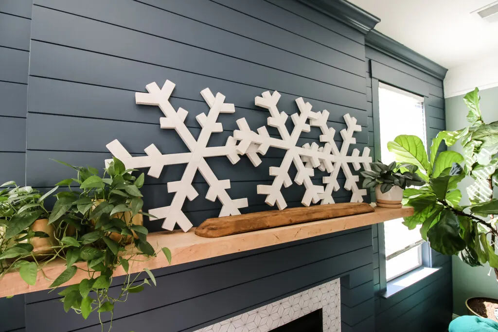 Completed wooden snowflakes on mantel