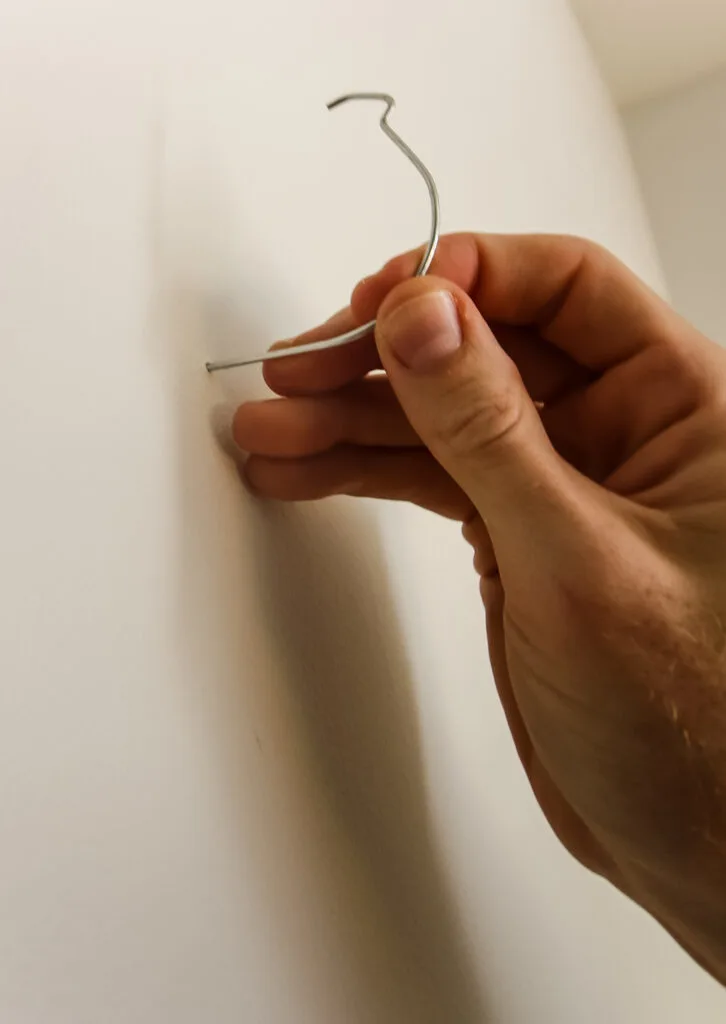 Inserting J hook into the wall